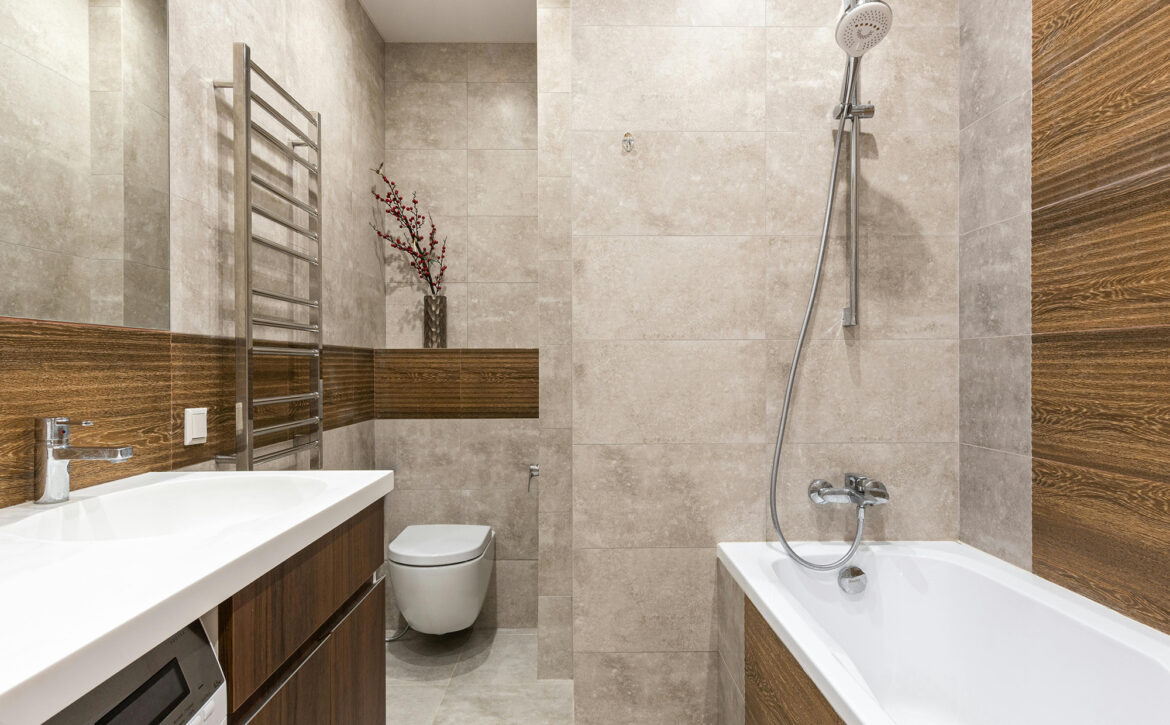 Modern bathroom featuring a smart toilet, sleek fixtures, and luxury finishes, showcasing advanced home technology for New Jersey homeowners.